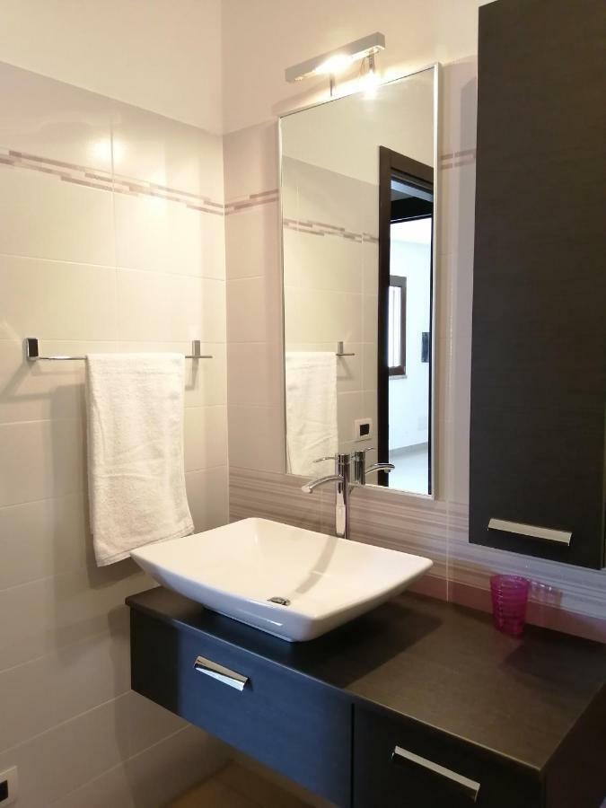 Апартаменты Casa Il Cortile Fiorito Тортоли Экстерьер фото